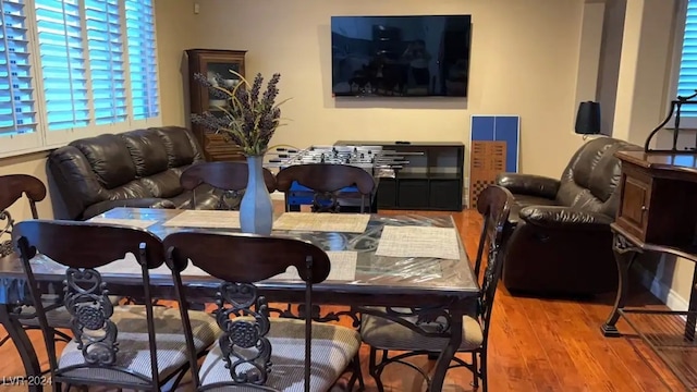 dining area with hardwood / wood-style flooring