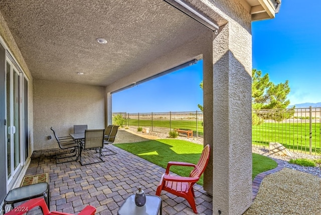 view of patio / terrace with outdoor dining space and a fenced backyard