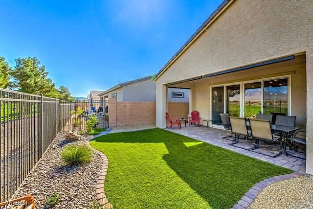 view of yard featuring a patio area and a fenced backyard