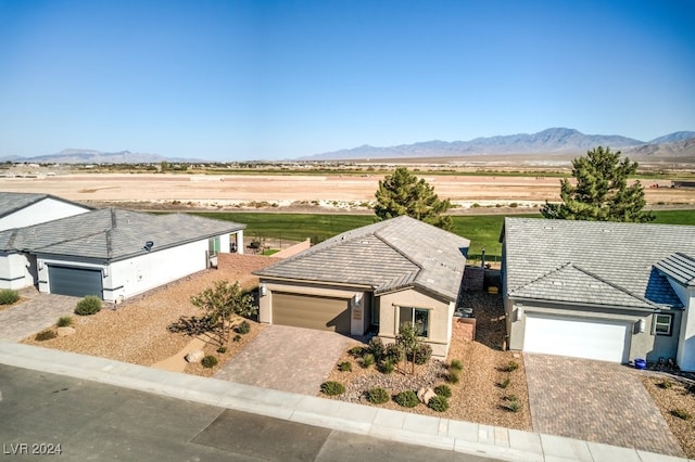 birds eye view of property with a mountain view