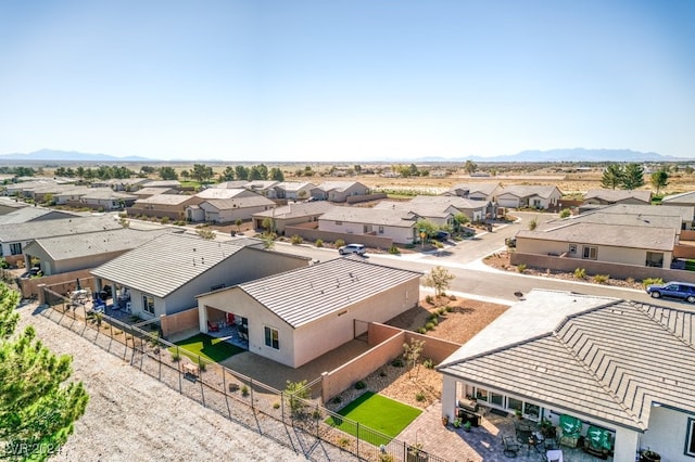 drone / aerial view featuring a residential view and a mountain view