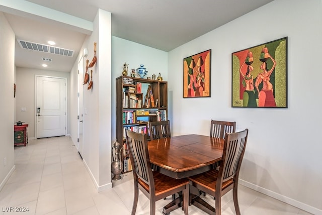 dining room with visible vents, baseboards, and light tile patterned flooring