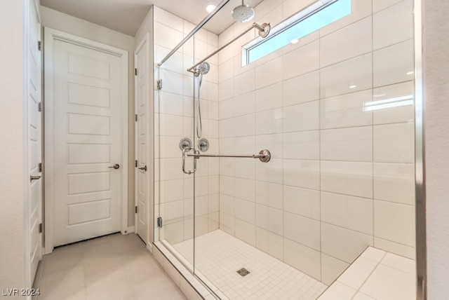 bathroom featuring a shower stall and tile patterned floors