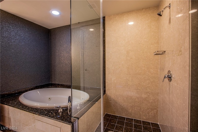 bathroom featuring separate shower and tub