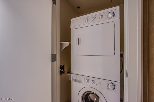 laundry area featuring stacked washer and dryer