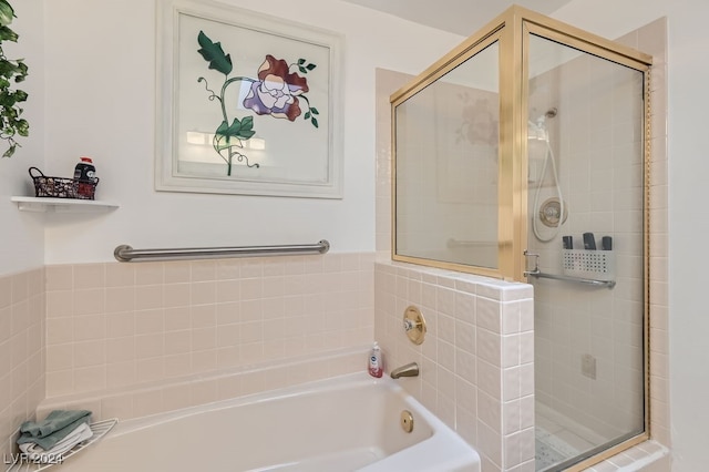 bathroom featuring separate shower and tub