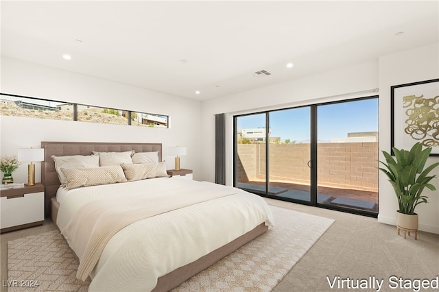 carpeted bedroom featuring access to exterior