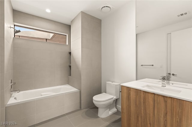 bathroom with vanity, tile patterned flooring, toilet, and a skylight