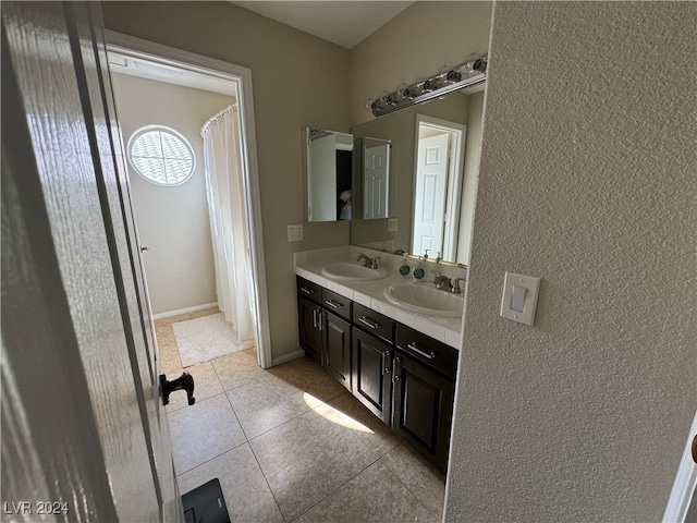 bathroom with vanity and tile patterned flooring