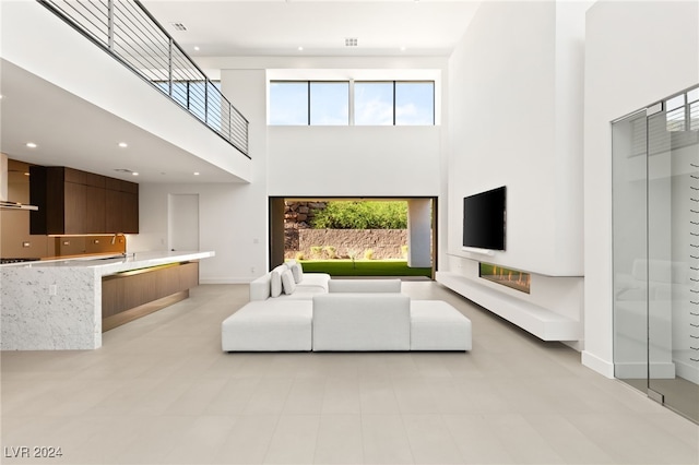 living room with a high ceiling