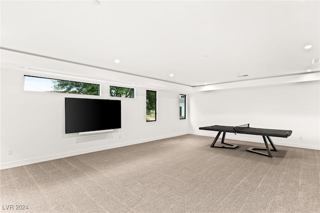 recreation room featuring carpet flooring and plenty of natural light