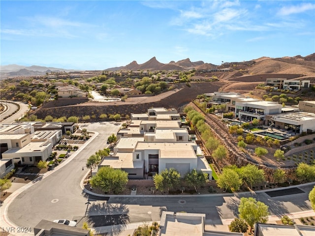 birds eye view of property featuring a mountain view