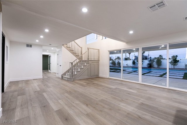 unfurnished living room featuring light wood-type flooring