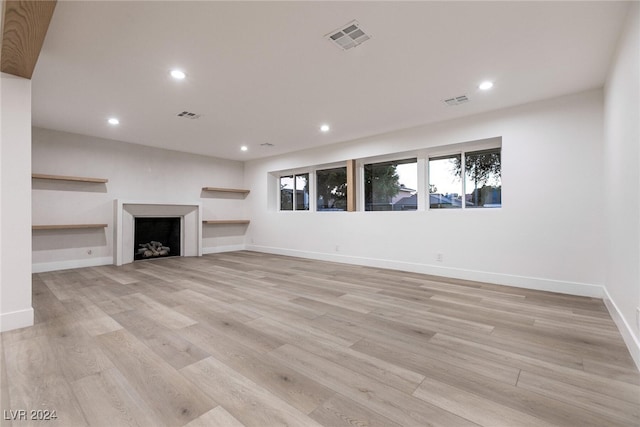 unfurnished living room featuring light wood-type flooring