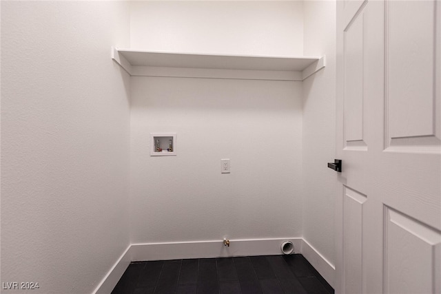 washroom featuring washer hookup, gas dryer hookup, and dark hardwood / wood-style floors