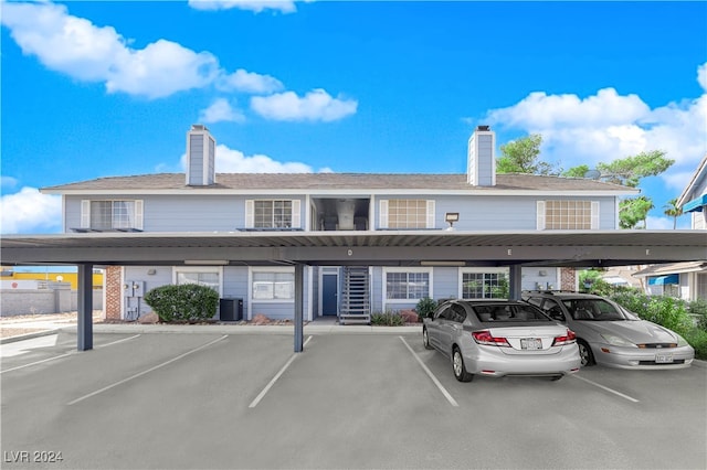 view of vehicle parking with a carport