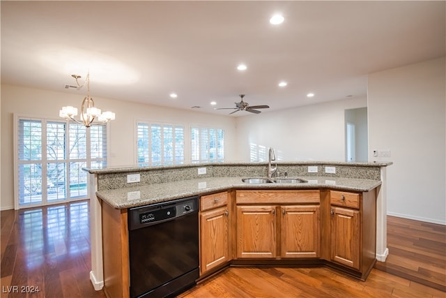 kitchen featuring light wood-type flooring, a healthy amount of sunlight, black dishwasher, and sink