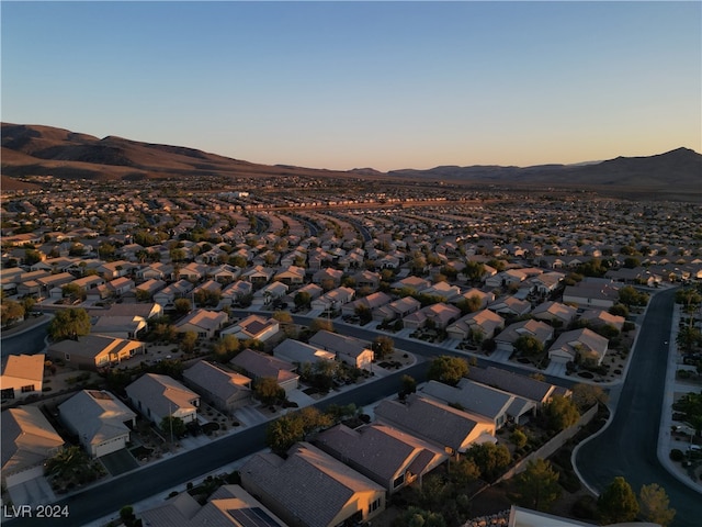 aerial view at dusk with a mountain view