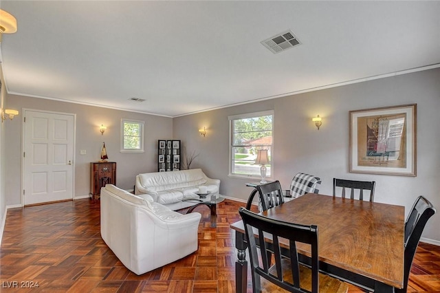 living room featuring dark parquet floors and ornamental molding