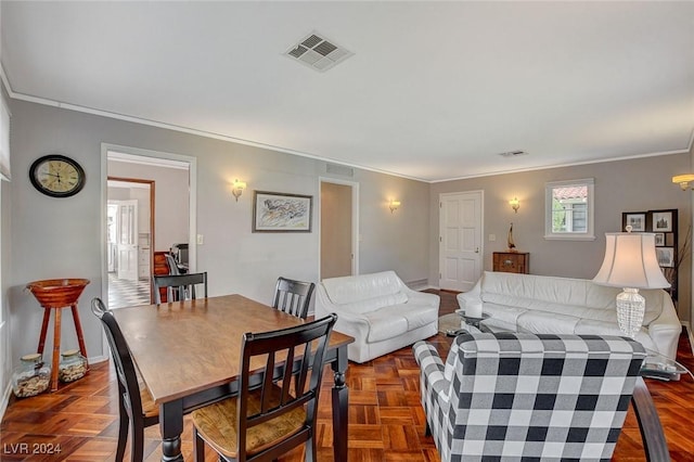 living room with dark parquet floors and ornamental molding