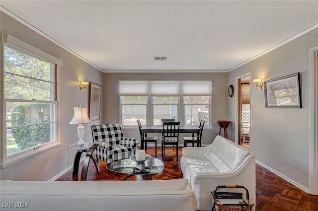 living room with dark parquet floors and ornamental molding