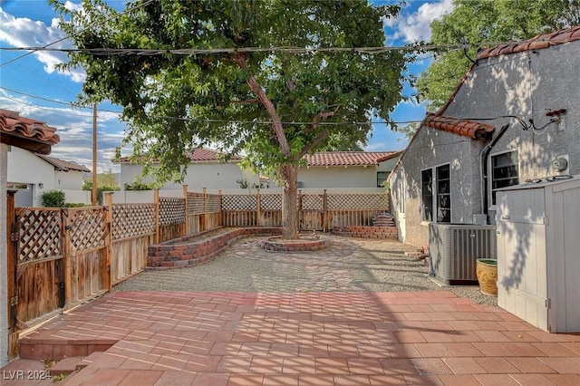 view of patio / terrace with central AC unit