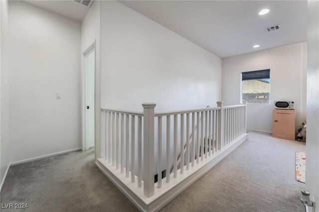 hallway featuring carpet floors