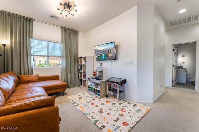 living room featuring a chandelier and light colored carpet