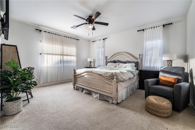 carpeted bedroom with ceiling fan