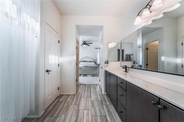 bathroom featuring vanity and ceiling fan