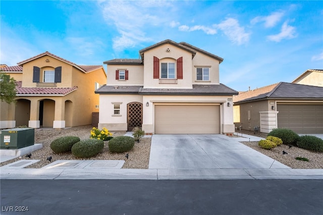 mediterranean / spanish-style home featuring cooling unit and a garage