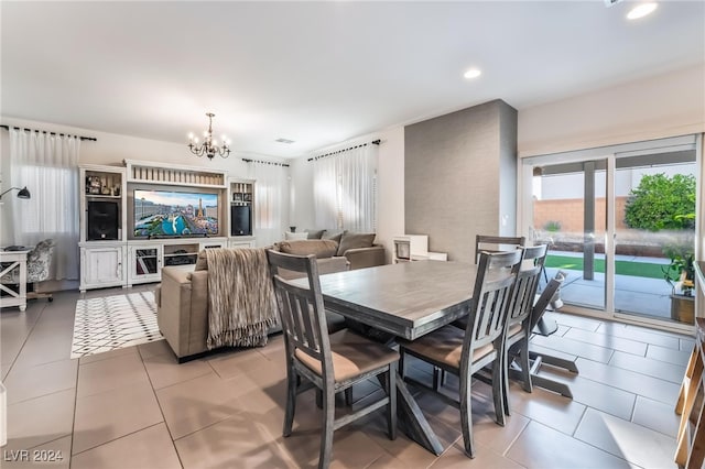 tiled dining area with a notable chandelier