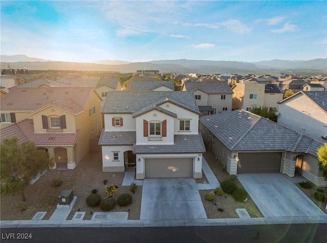 birds eye view of property featuring a mountain view