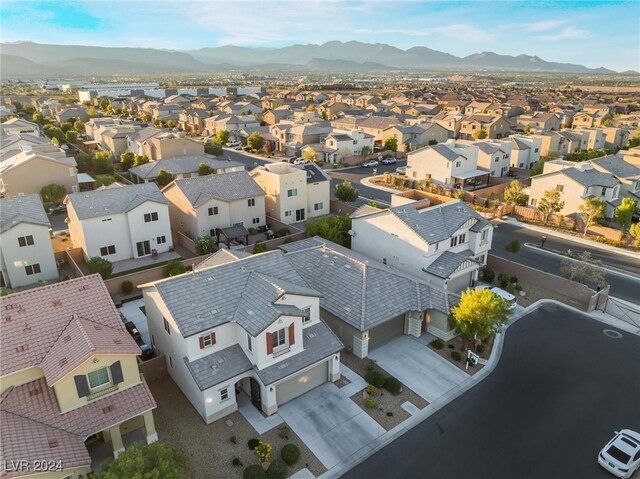 birds eye view of property with a mountain view