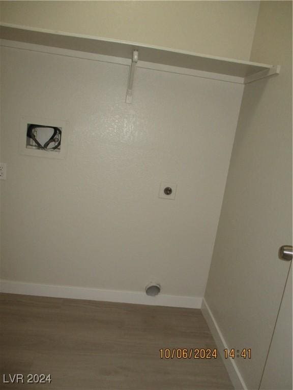 laundry area featuring hardwood / wood-style flooring