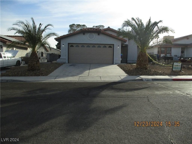 view of front of property with a garage