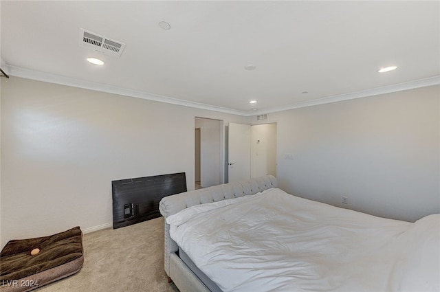 bedroom with light carpet and ornamental molding