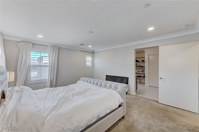 bedroom featuring light carpet and ornamental molding