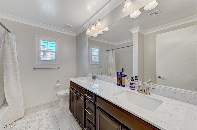 full bathroom with ornamental molding, vanity, toilet, and shower / bath combo with shower curtain