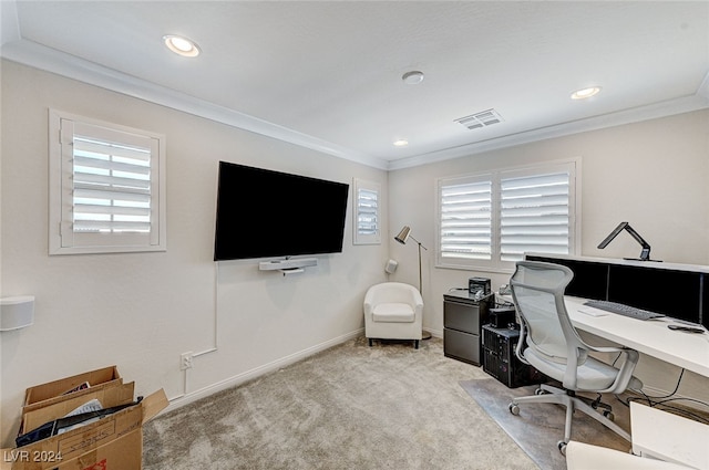 home office featuring crown molding, light colored carpet, and a wealth of natural light