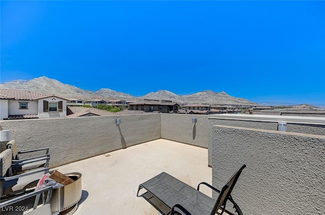 view of patio / terrace featuring a balcony and a mountain view