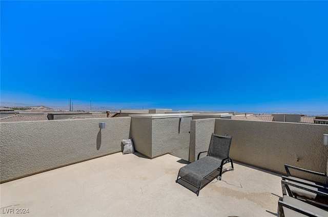 view of patio featuring a balcony