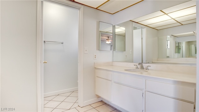 bathroom with ceiling fan, vanity, and tile patterned flooring