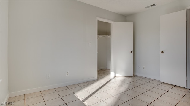 spare room with light tile patterned floors