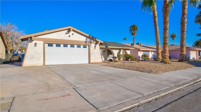 single story home with a garage