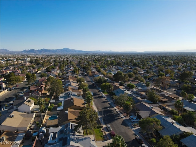 birds eye view of property with a mountain view