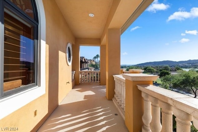 balcony featuring a mountain view