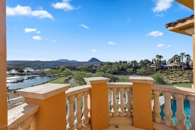 balcony with a water and mountain view