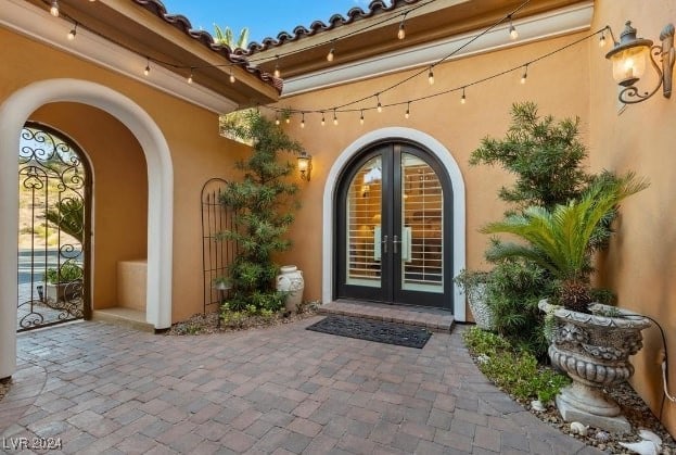 doorway to property featuring french doors and a patio