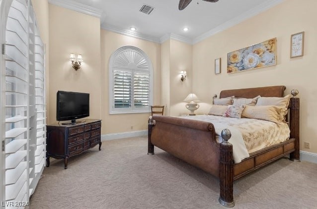 bedroom featuring ceiling fan, light colored carpet, and crown molding